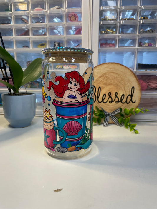 The little mermaid can glass with decorative lid.